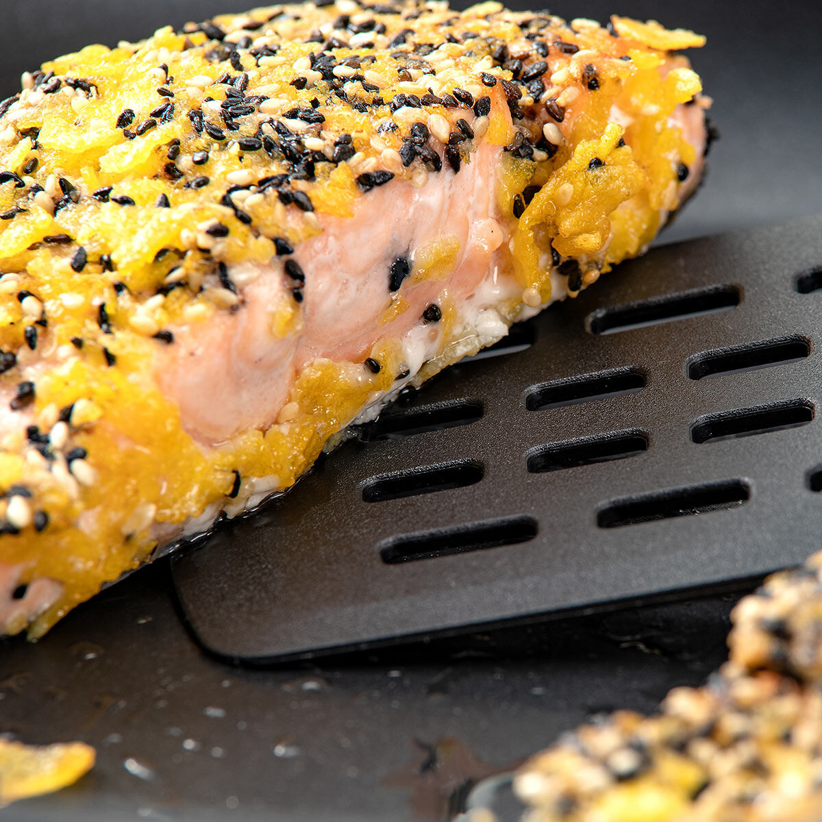 Pfannenwender mit Schlitzen Statement